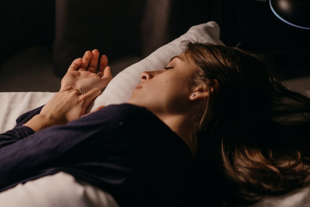 A Woman Lying on Bed Sleeping