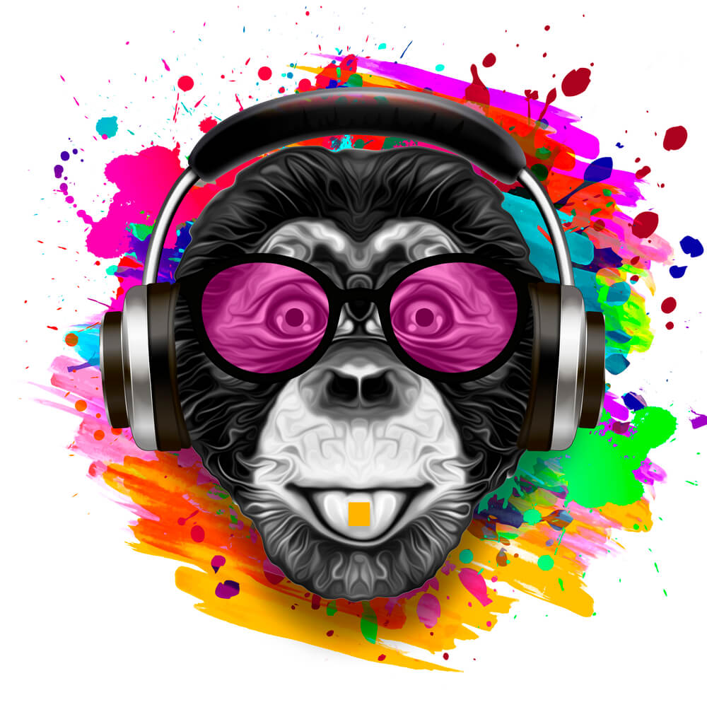 Colorful artistic monkey in eyeglasses with colorful paint splatters on white background
